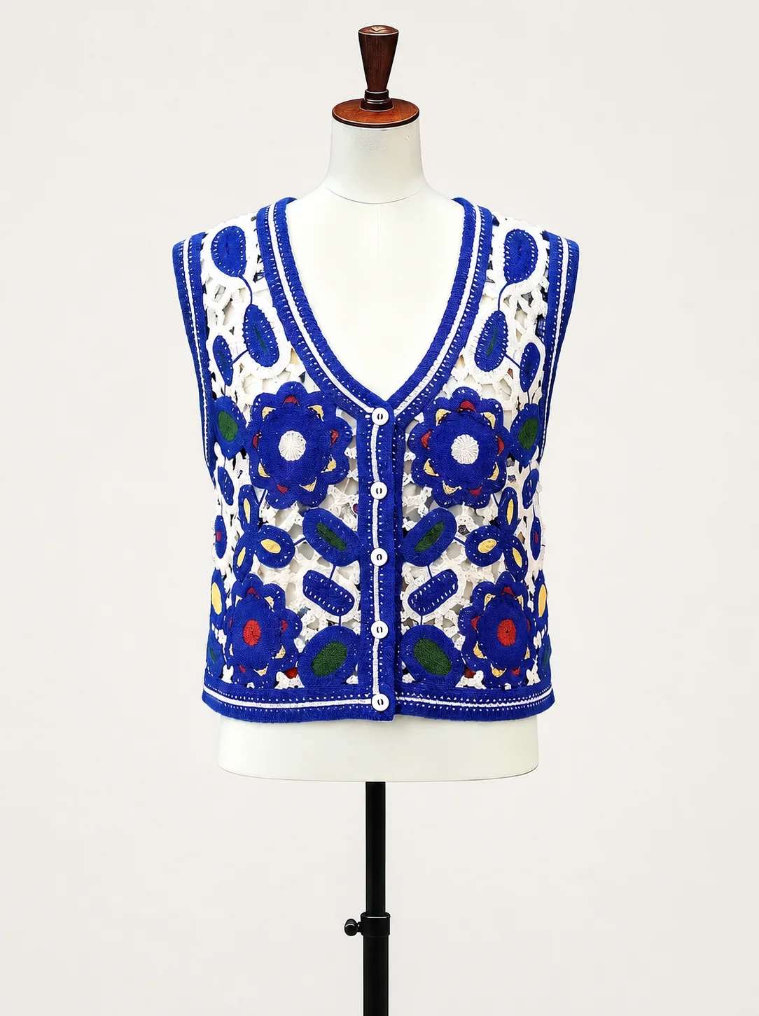 Wholesale blue floral crochet-look button vest for OEM and private label production